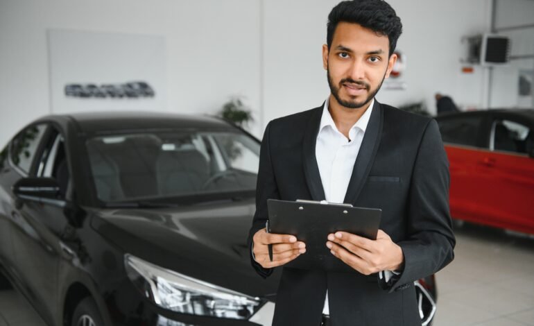 indian cheerful car salesman showing new car at sh 2026 01 09 01 17 40 utc